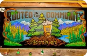 The 'Rooted in the Community' mural at North 47